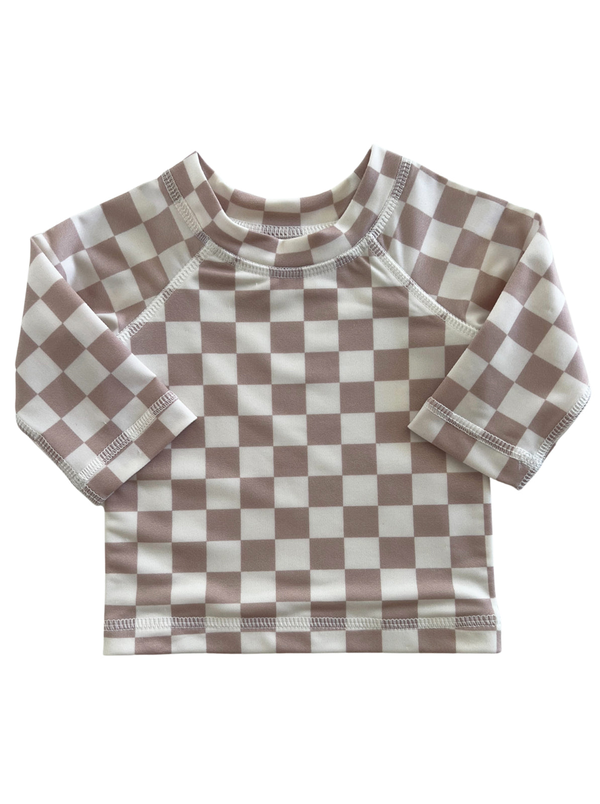 Brown and white checkered long-sleeve shirt for children, featuring a soft fabric and rounded neckline.