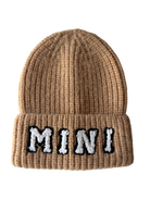 Brown knit beanie with a turned-up cuff featuring the word "MINI" in black and white lettering.
