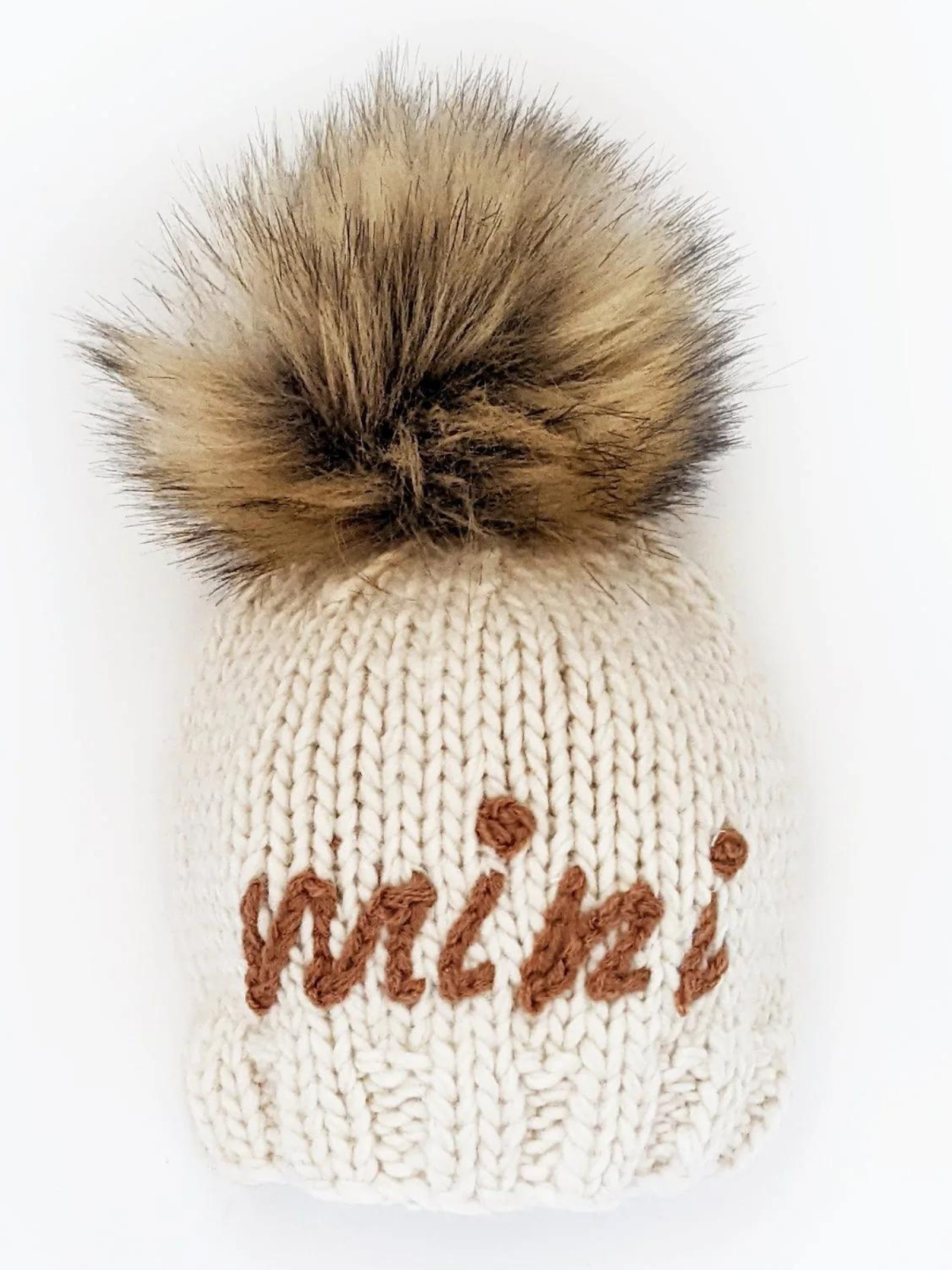 Cream knit beanie with a fluffy brown pom-pom and the word "mini" embroidered in brown.