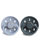 Two silicone pacifiers in light blue and dark gray, featuring round designs and ventilation holes.