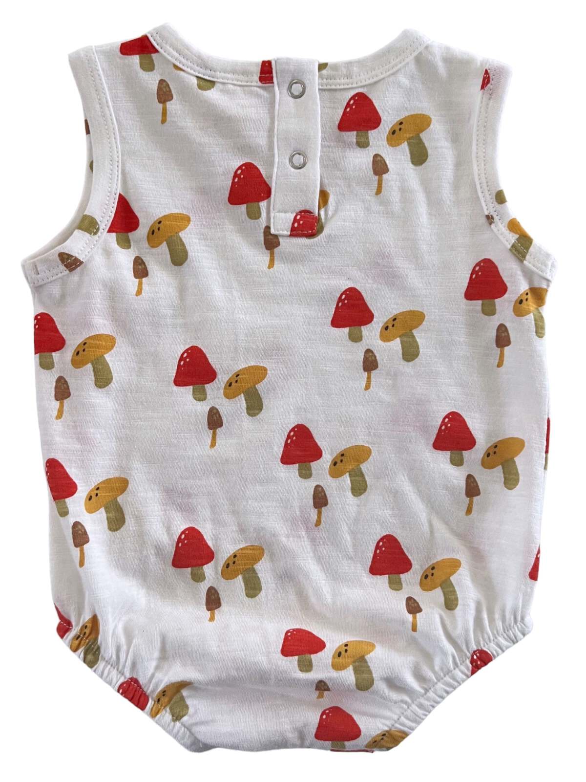 Back view of a children's romper with a playful mushroom print in red, yellow, and brown on a white background.