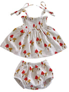 Toddler outfit with a smocked dress and matching bloomers, featuring a playful mushroom print.