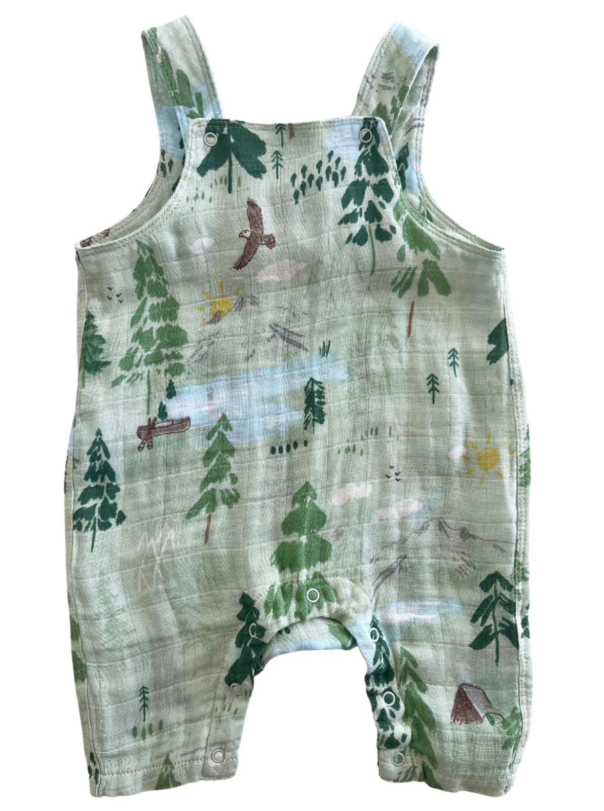Green baby romper with woodland animal print featuring trees, birds, and a sun on a soft fabric background.