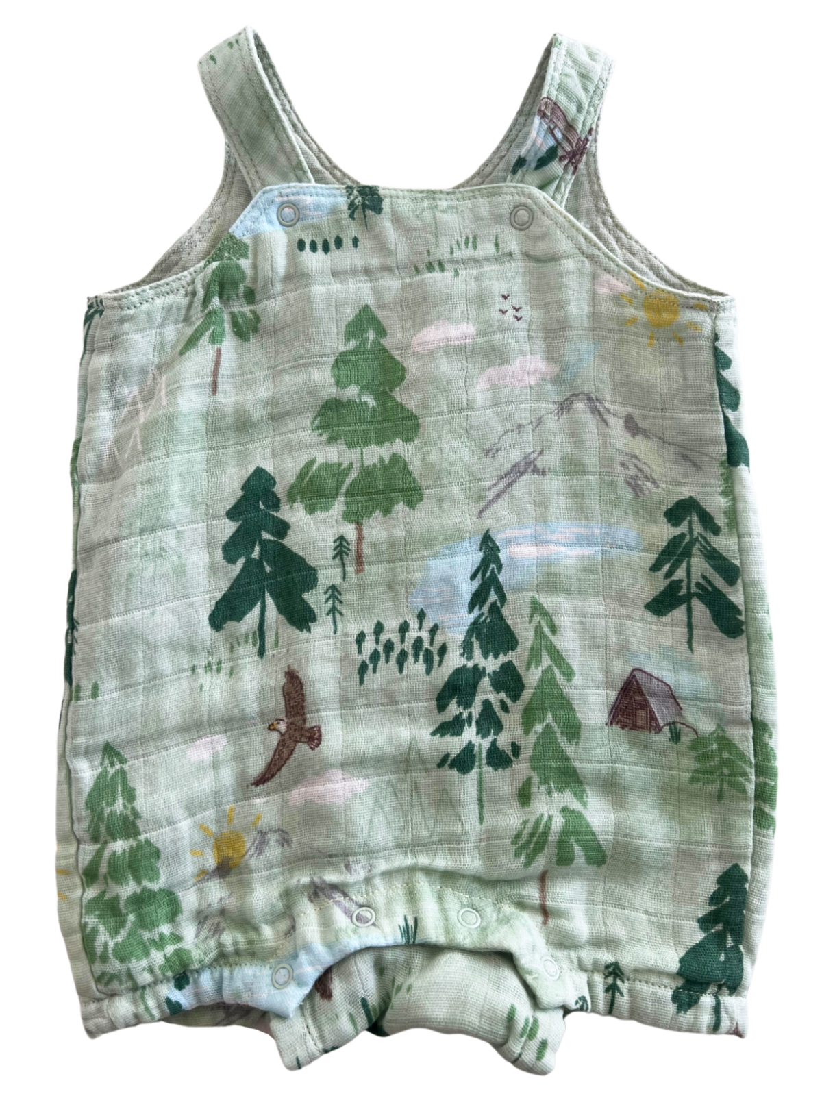 Green toddler romper featuring a nature print with trees, birds, and a tent design. Ideal for outdoor adventures.