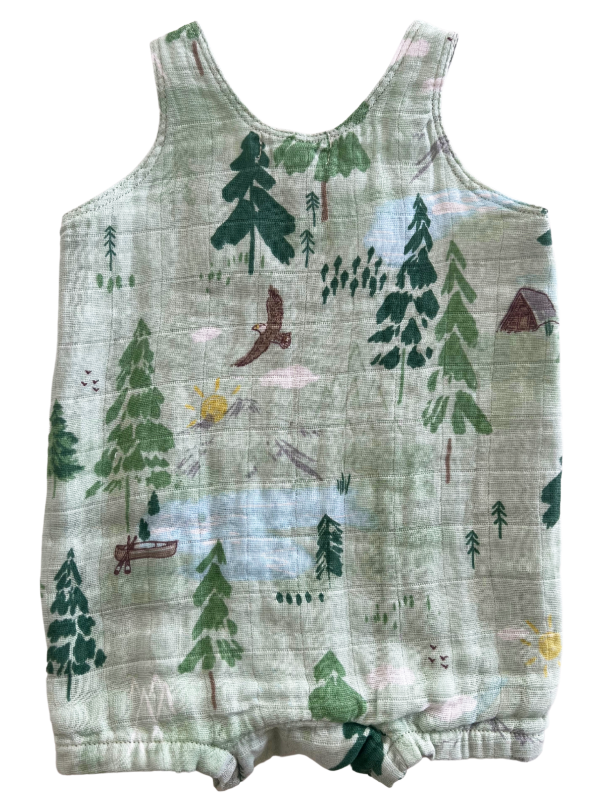 Green sleeveless romper featuring a nature print with trees, animals, and scenic elements. Ideal for children.