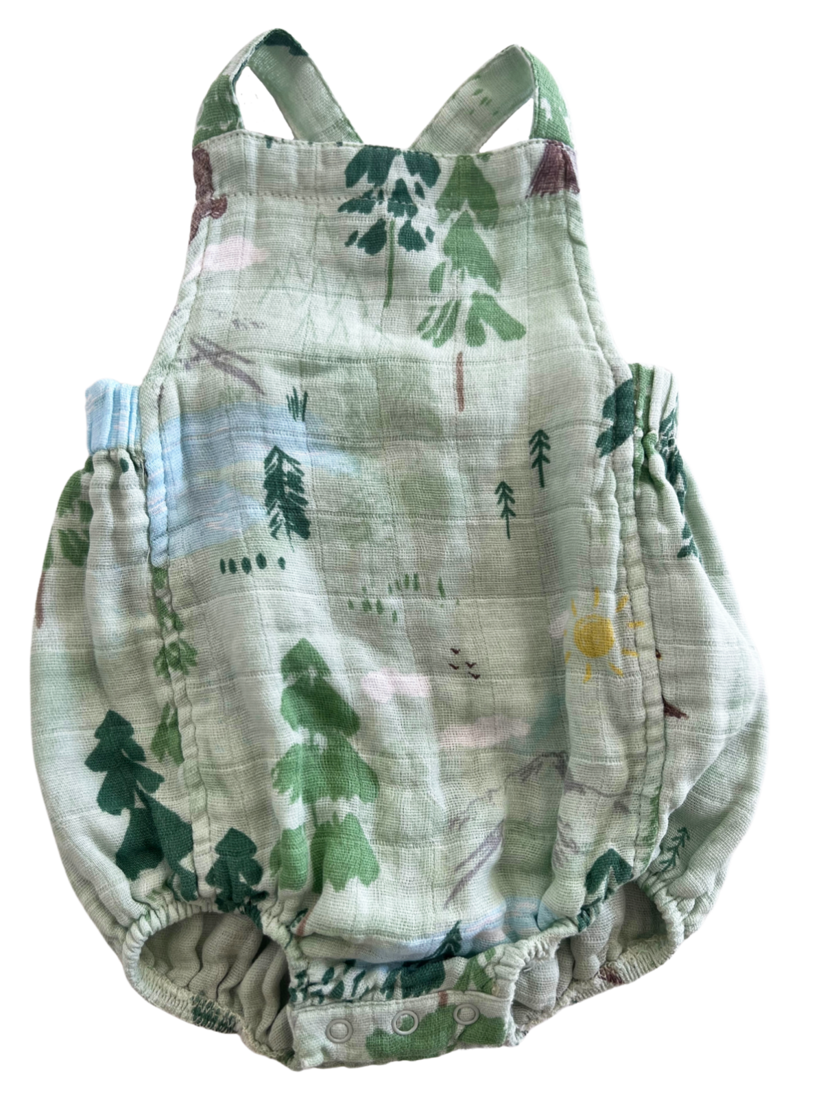 Green baby romper featuring a nature-inspired design with trees and a sun. Perfect for outdoor adventures.