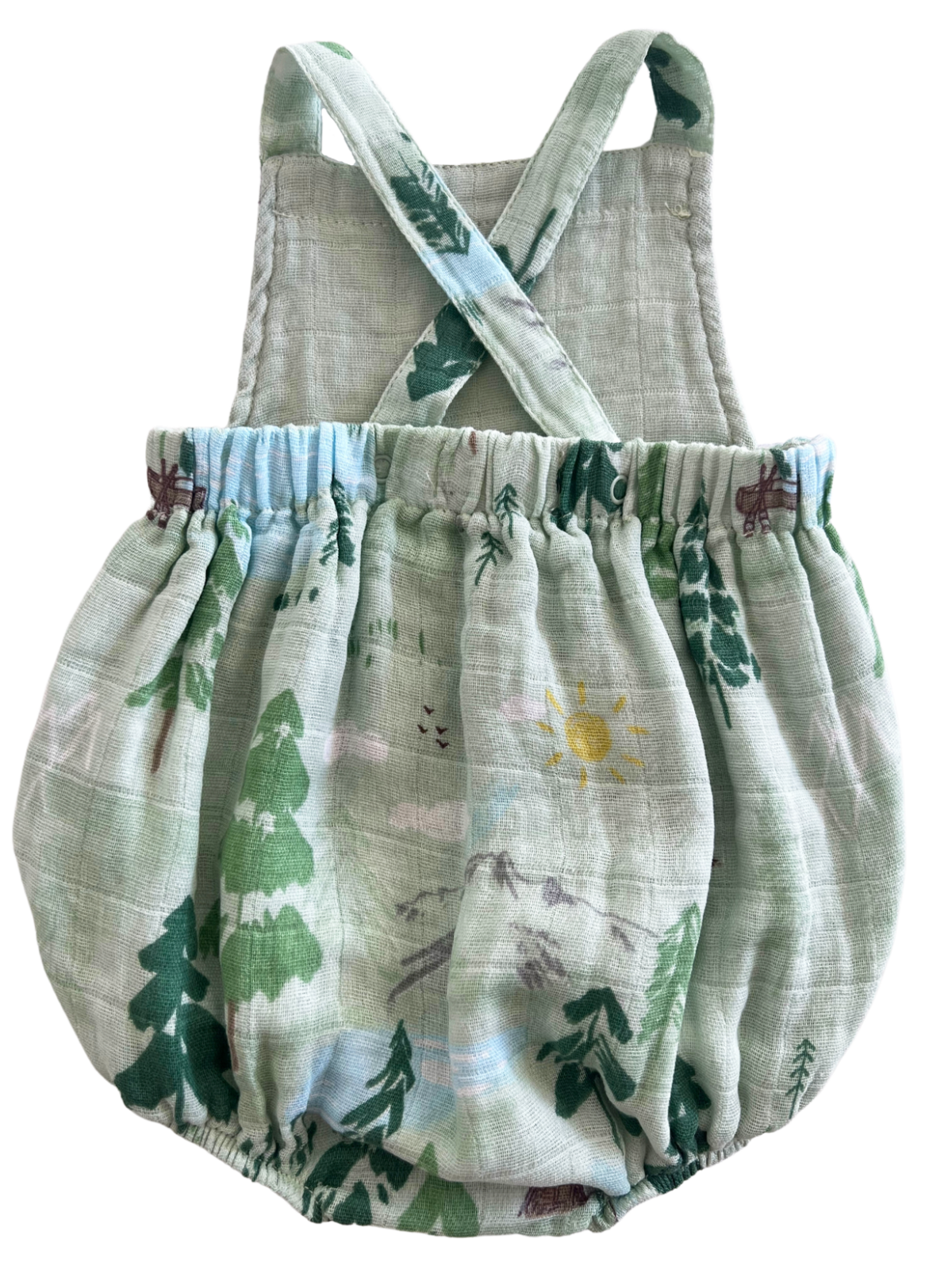 Light green baby romper with nature print featuring trees, mountains, and sun, designed for comfort and style.