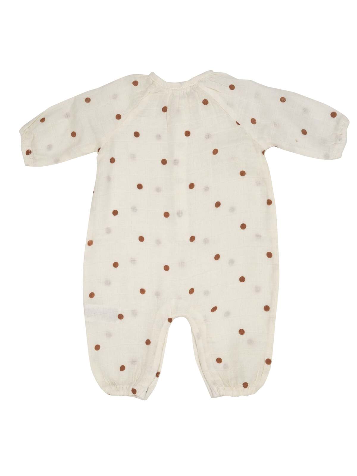 Back view of a light-colored baby onesie with brown polka dots on soft fabric.