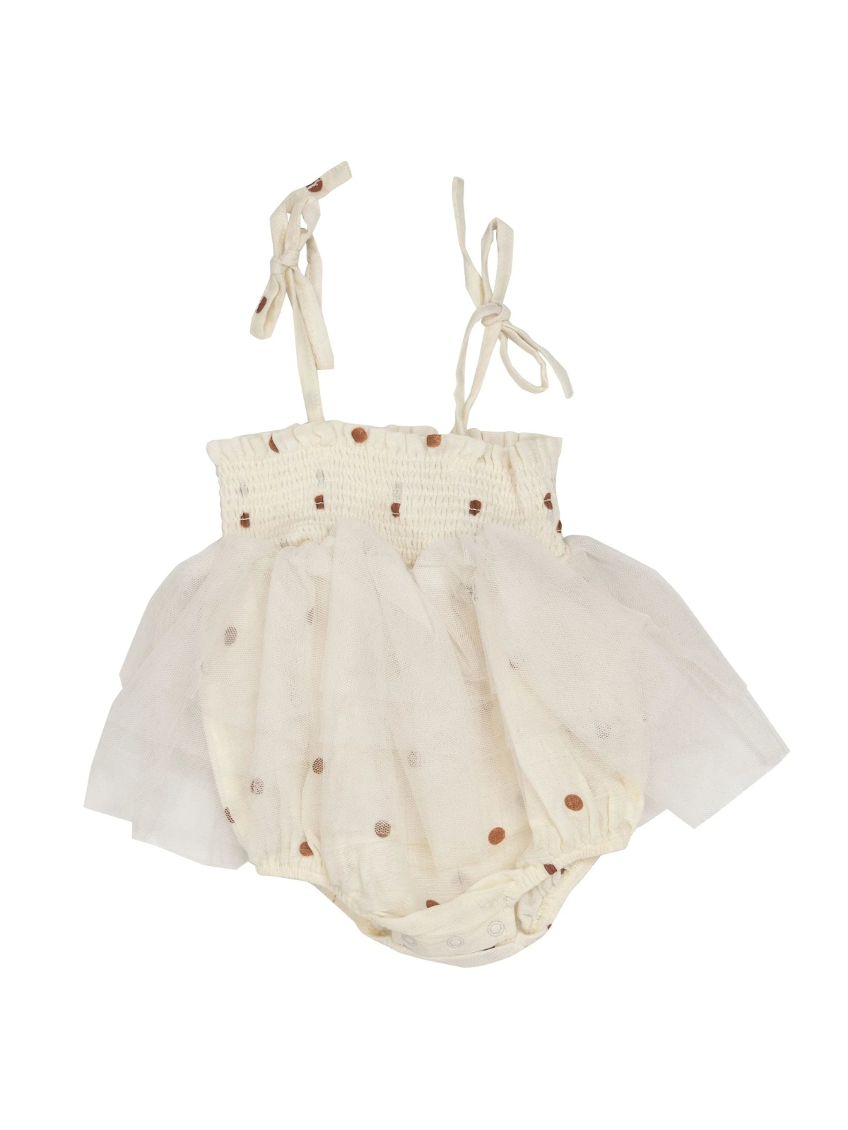 Light beige baby romper with polka dots and tulle skirt, featuring adjustable straps and snap closures at the bottom.