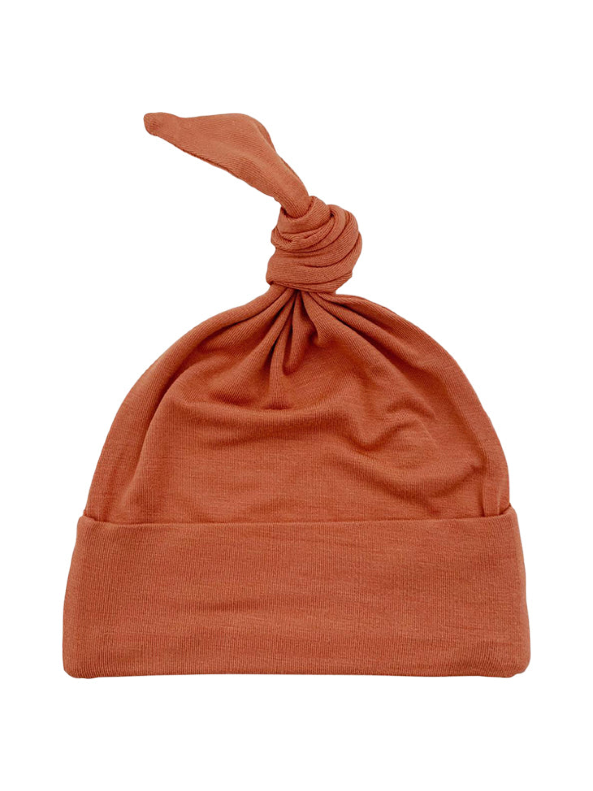 Rust-colored, soft knit hat with a knot on top and a folded brim for a stylish look.