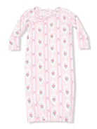 Pink floral nightgown with long sleeves, featuring a ruffled collar and decorative bows.