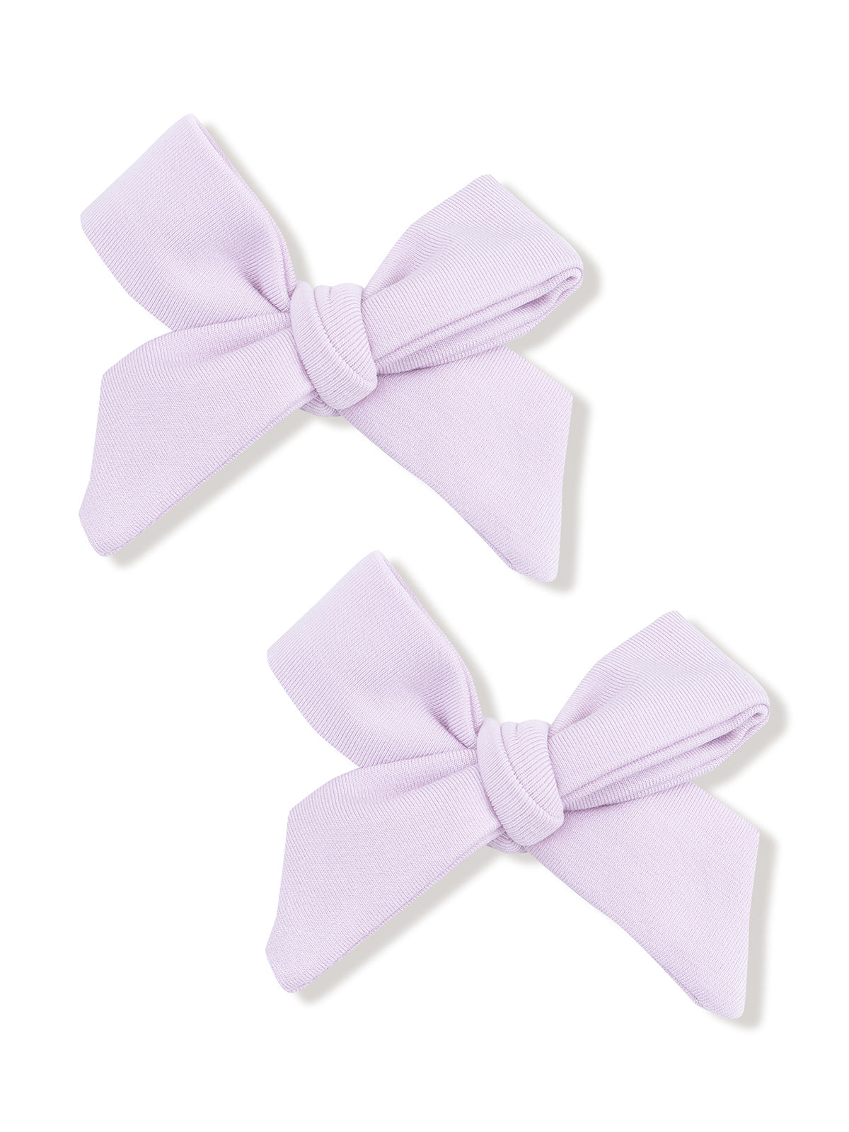 Two lavender fabric hair bows tied in knots, arranged symmetrically on a white background.