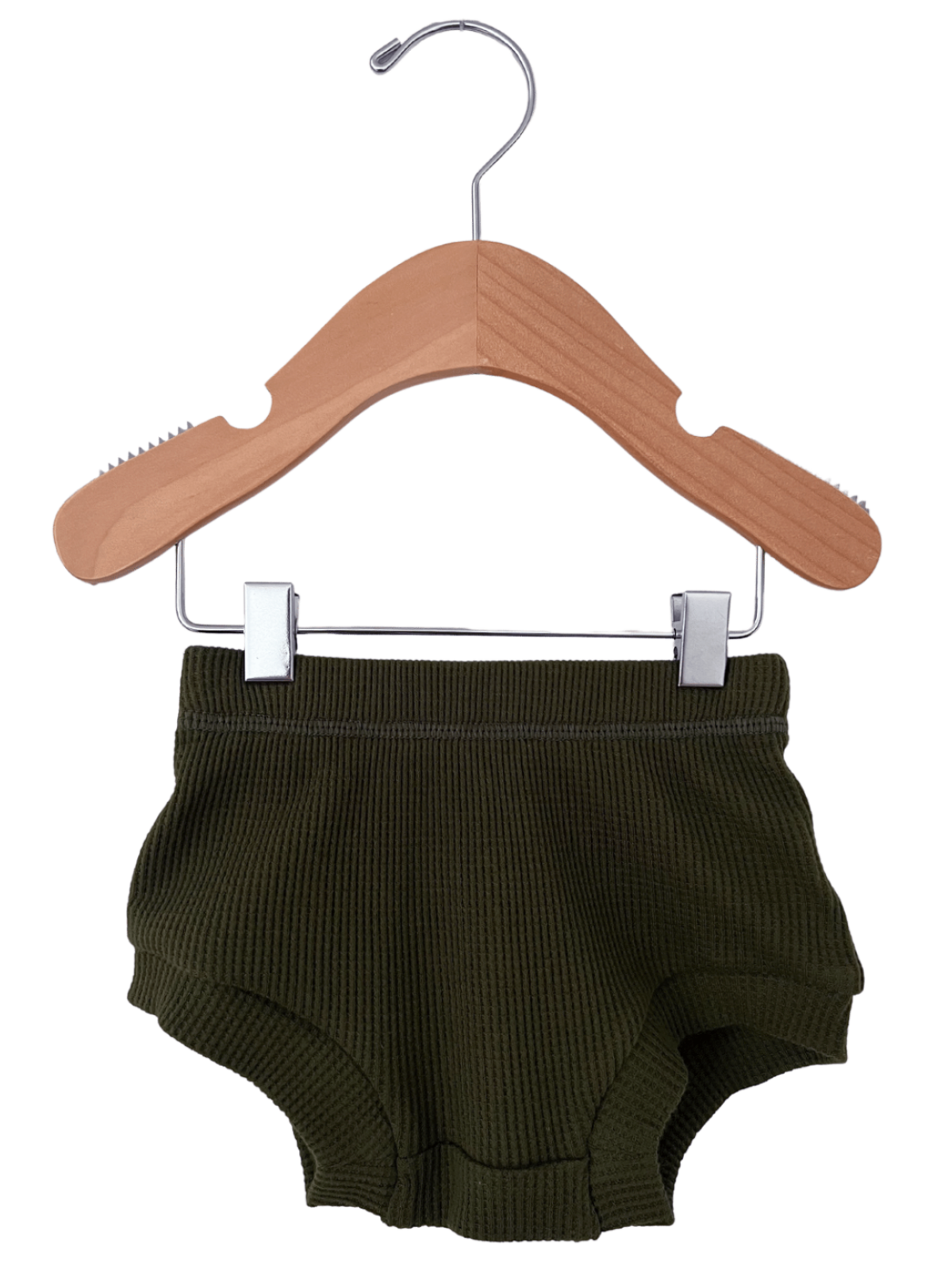 Olive green ribbed toddler shorts hanging on a wooden hanger.