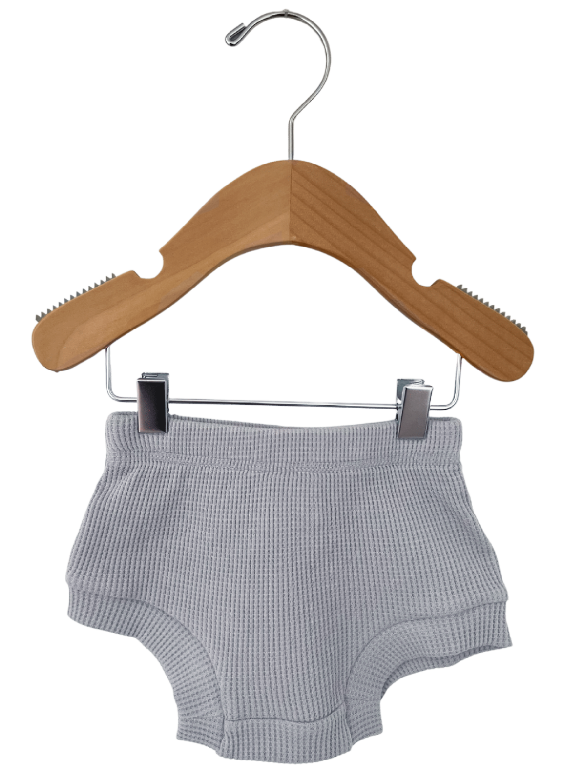 Gray cotton shorts hanging on a wooden hanger against a white background.
