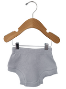 Gray cotton shorts hanging on a wooden hanger against a white background.