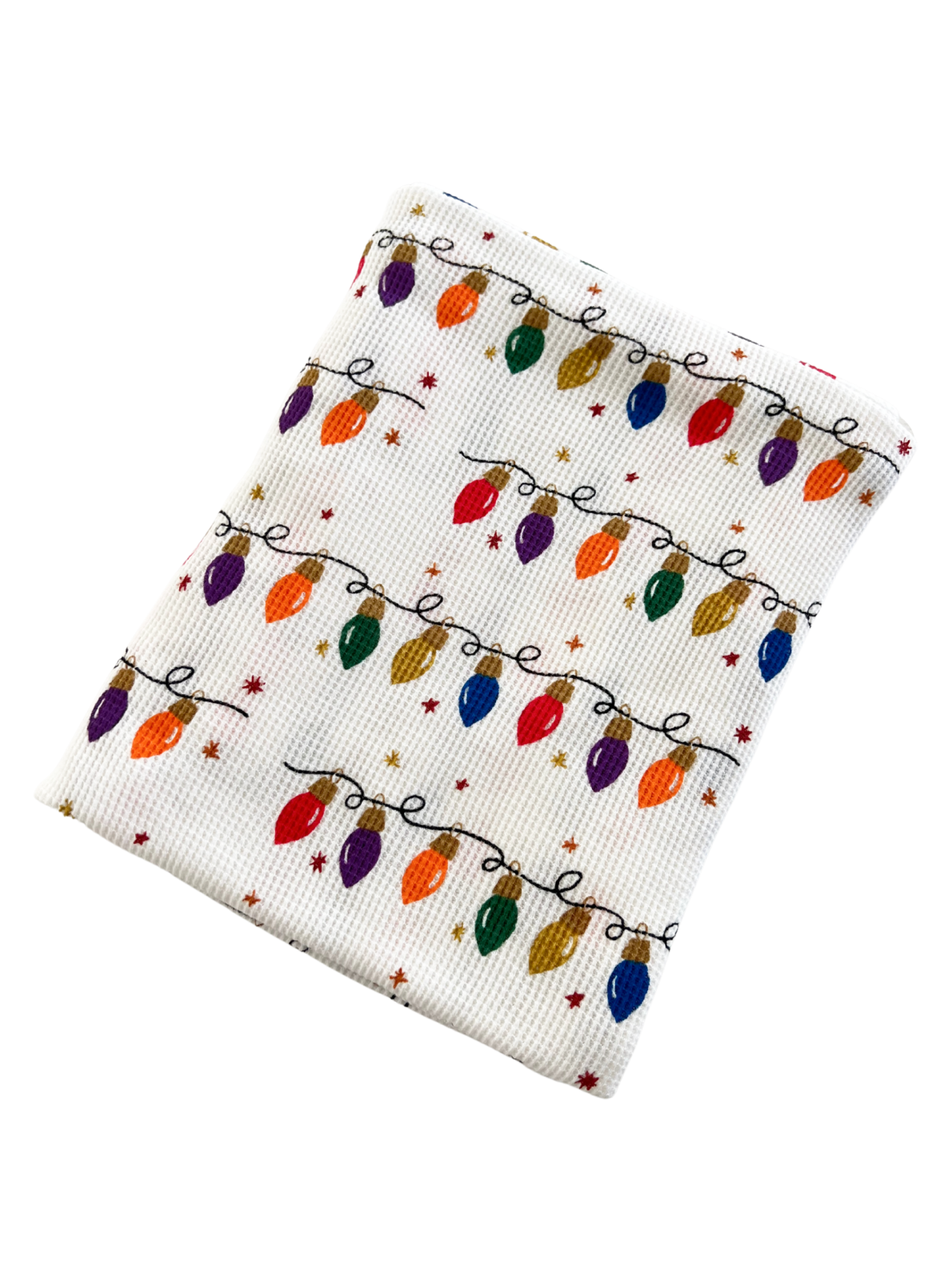 White fabric with colorful Christmas lights pattern and small stars, perfect for holiday decorations or gifts.