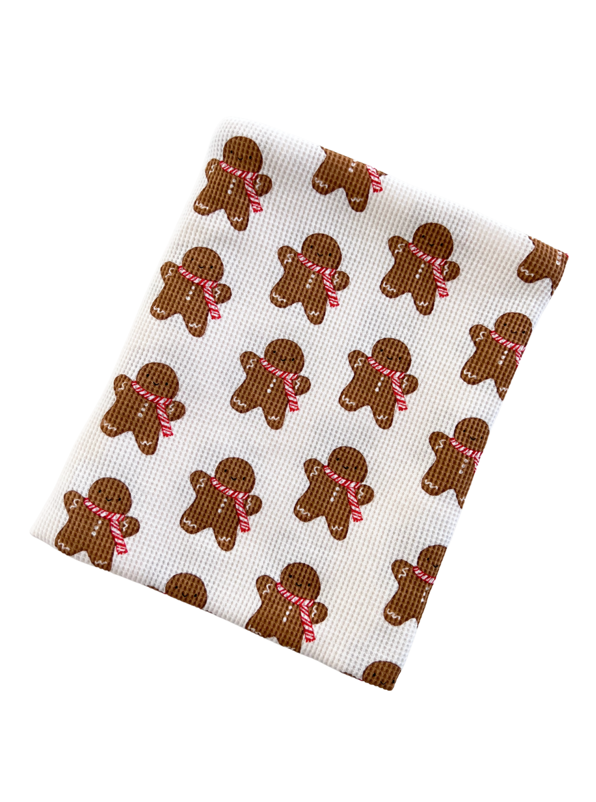 Gingerbread man patterned dishcloth featuring brown figures with red ribbons on a white background.
