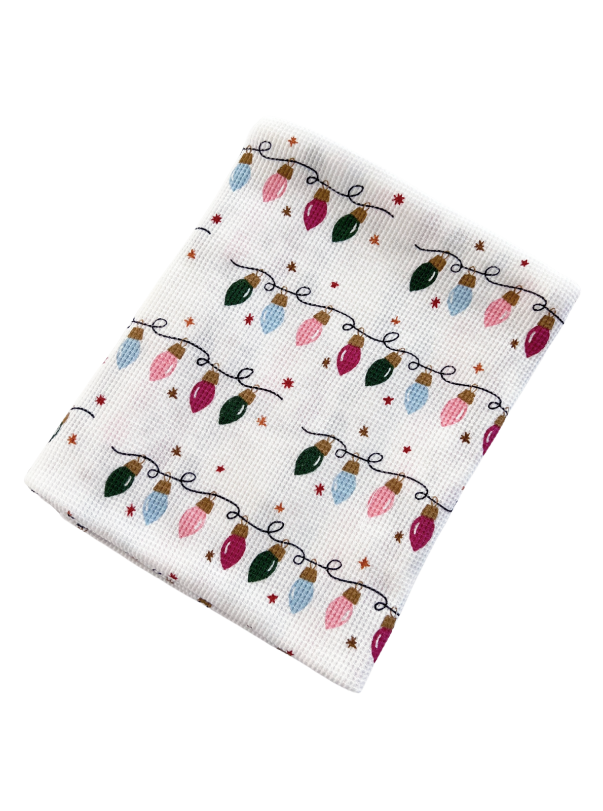Patterned holiday dish towel featuring colorful Christmas lights and small stars on a white background.