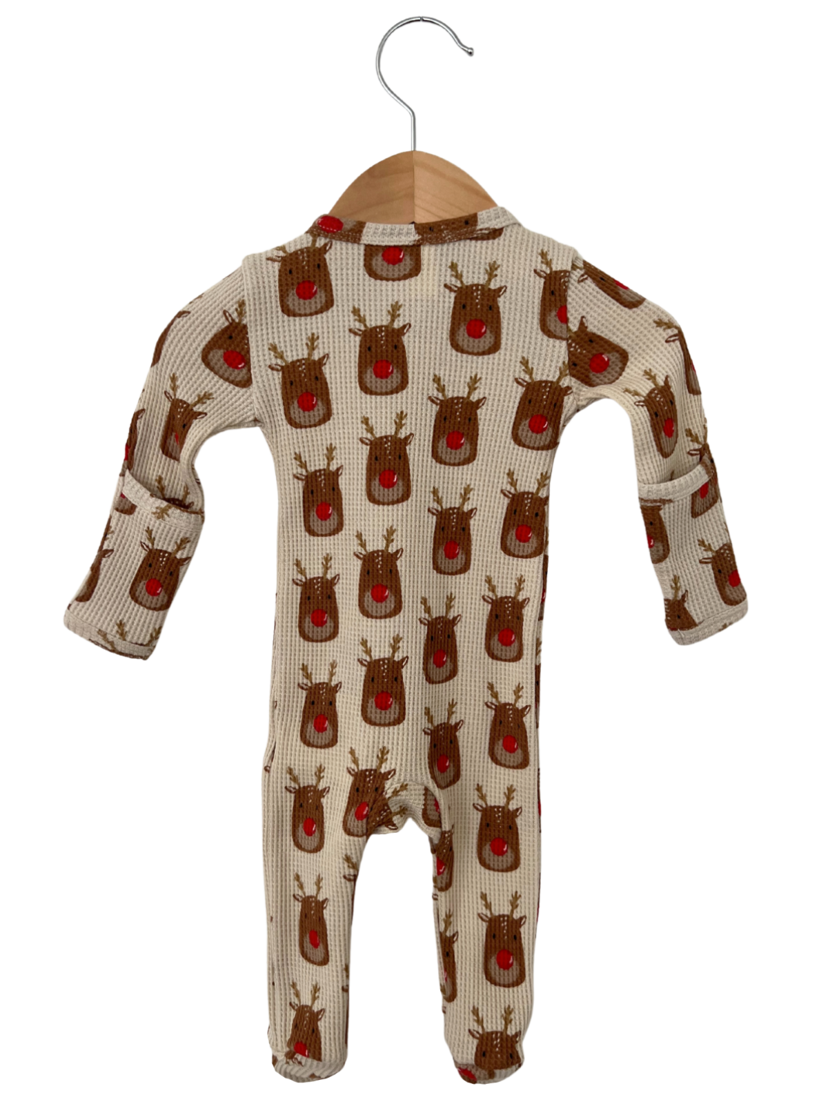 Baby onesie with reindeer print, featuring a soft fabric and long sleeves, hanging on a wooden hanger.