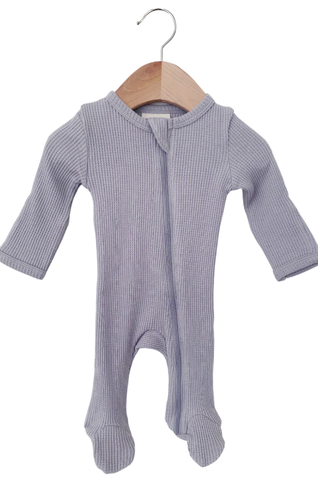 Light purple ribbed baby onesie hanging on a wooden hanger.