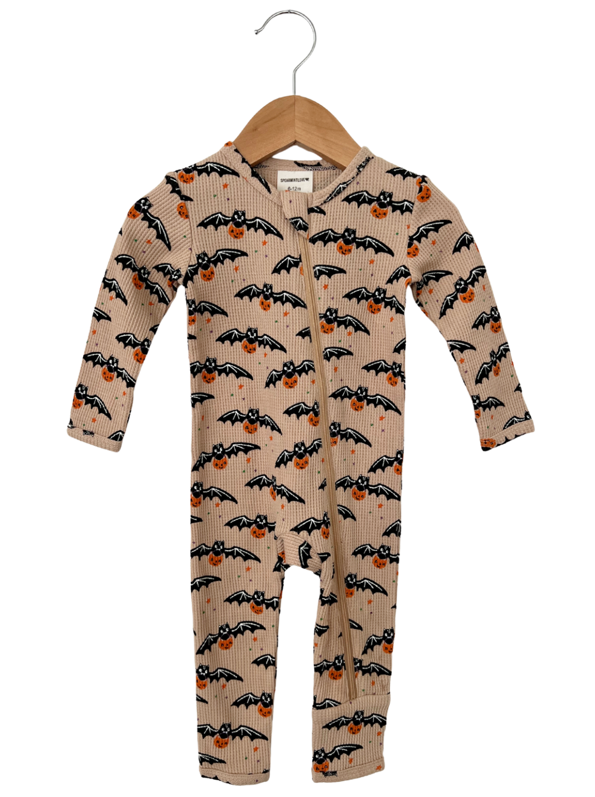 Infant onesie with bat and pumpkin print, featuring a hood and zipper, hanging on a wooden hanger.