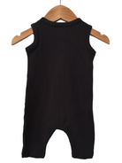 Black sleeveless ribbed baby romper hanging on a wooden hanger against a white background.