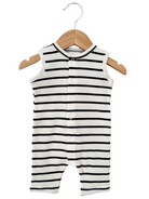 Black and white striped infant onesie hanging on a wooden hanger.