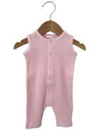 Light pink ribbed baby onesie hanging on a wooden hanger.