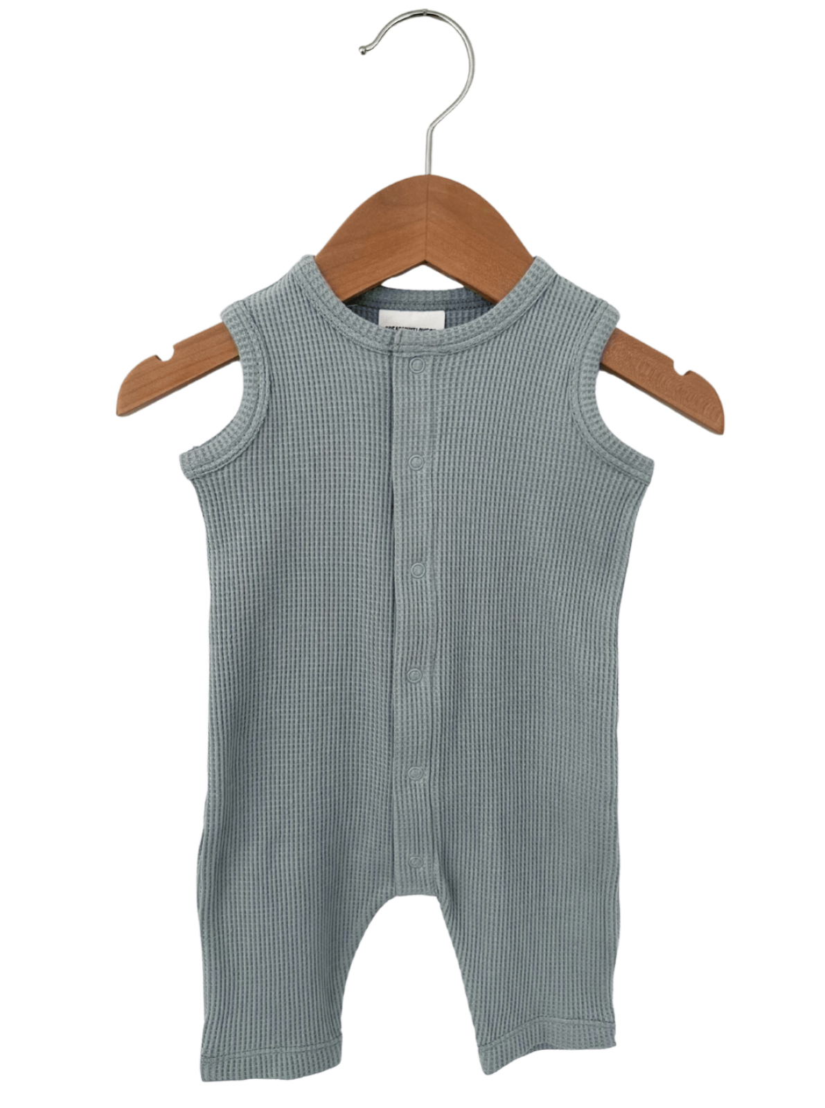 Light grey ribbed infant onesie hanging on a wooden hanger, featuring buttons down the front.