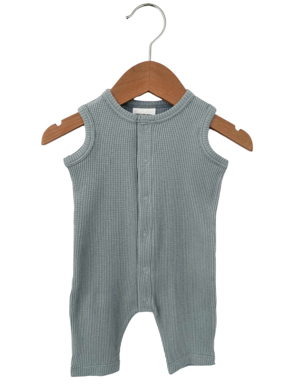 Light grey ribbed infant onesie hanging on a wooden hanger, featuring buttons down the front.