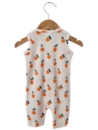 Back view of a baby romper with orange fruit print, hanging on a wooden hanger against a white background.