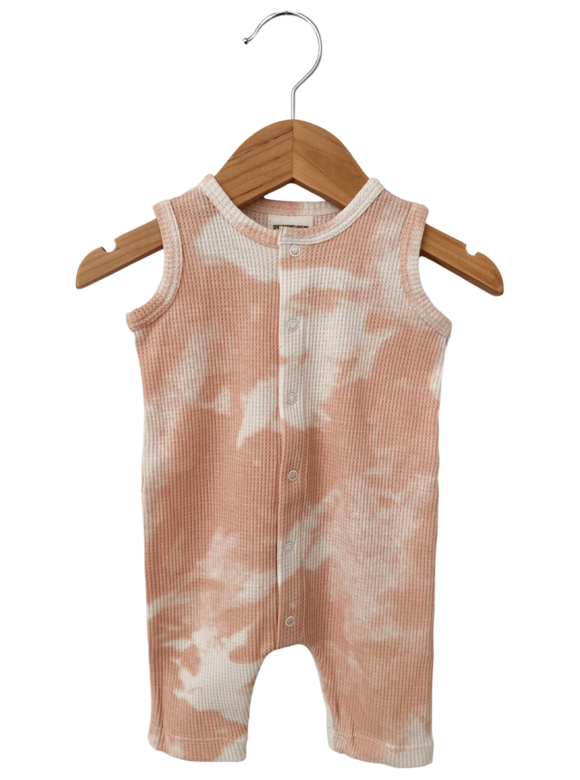 Peach tie-dye infant onesie hanging on a wooden hanger against a white background.