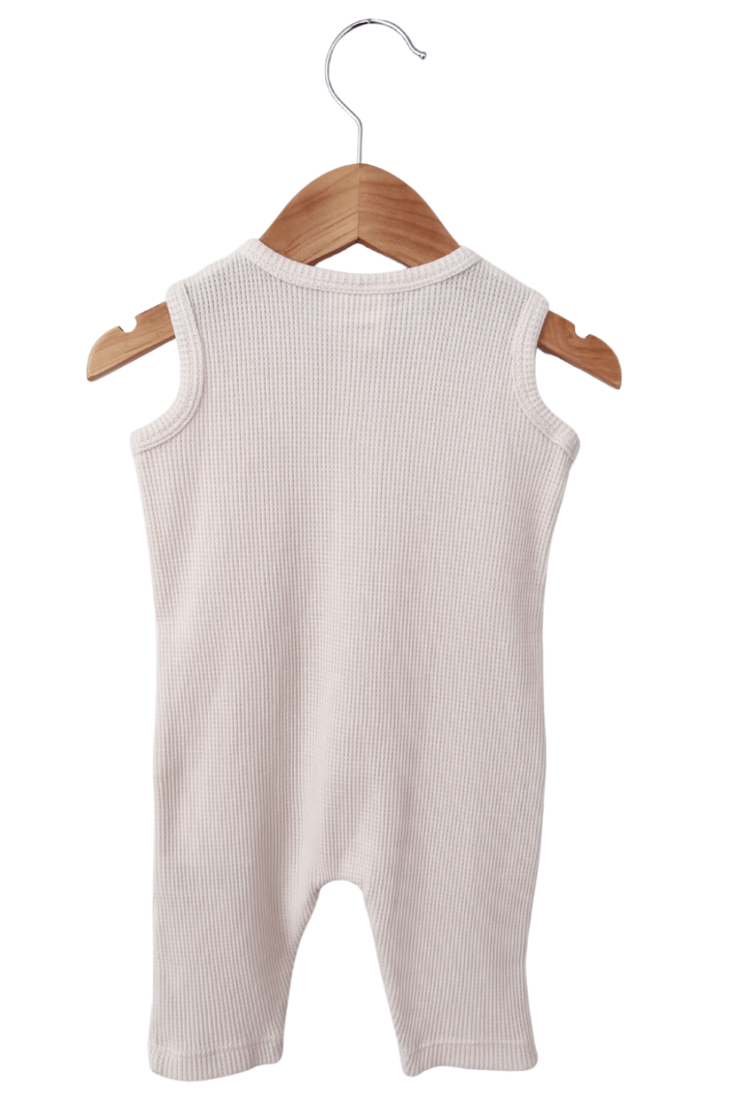 Back view of a beige ribbed sleeveless baby romper hanging from a wooden hanger.