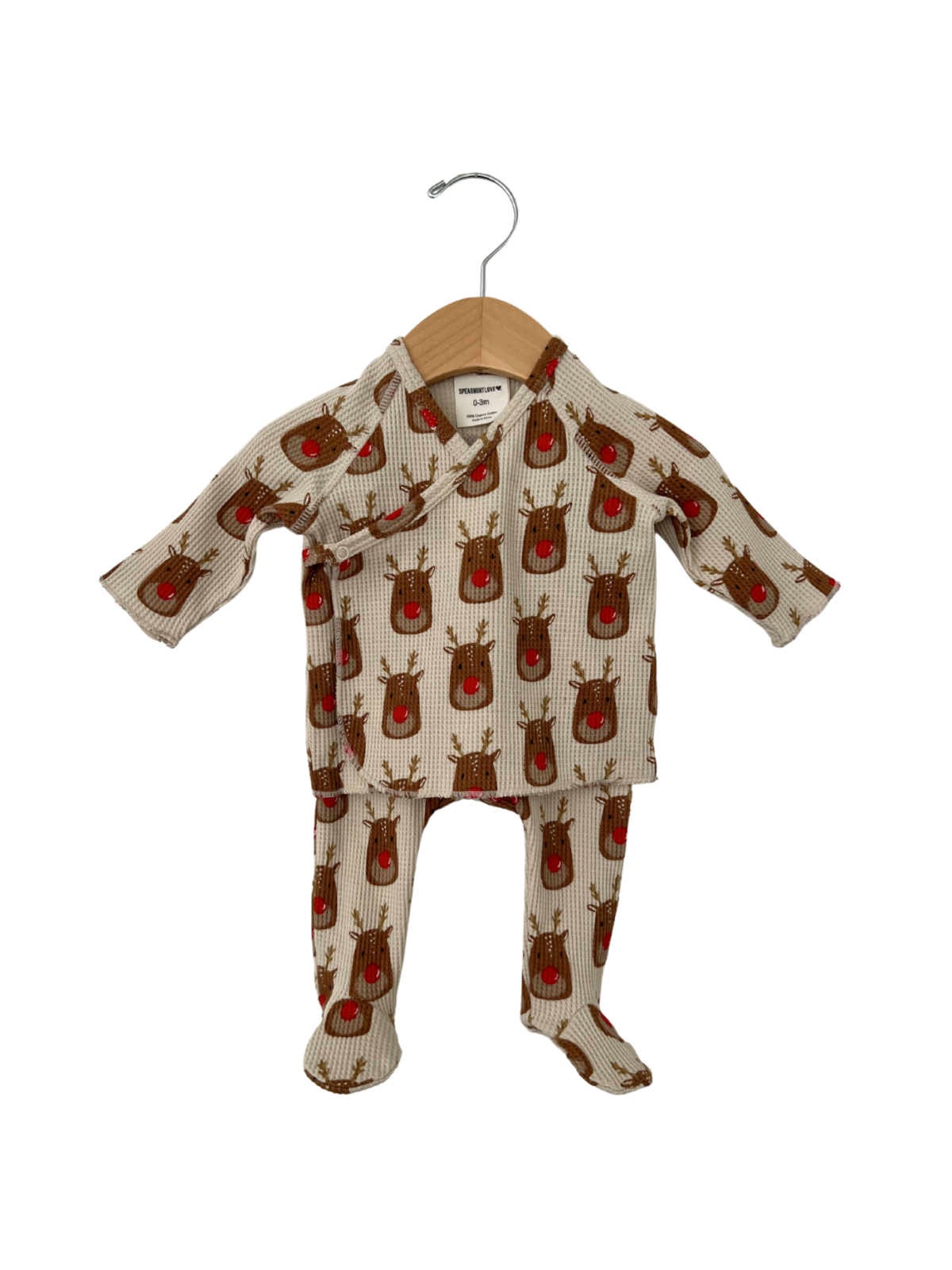 Child's cozy outfit featuring a reindeer print, displayed on a wooden hanger against a white background.