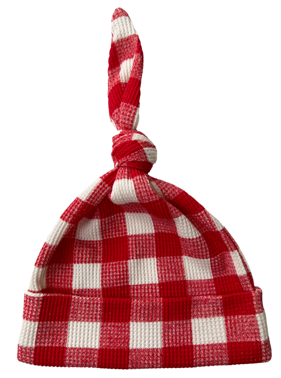 Red and white checkered beanie hat with a knot on top, folded at the brim.