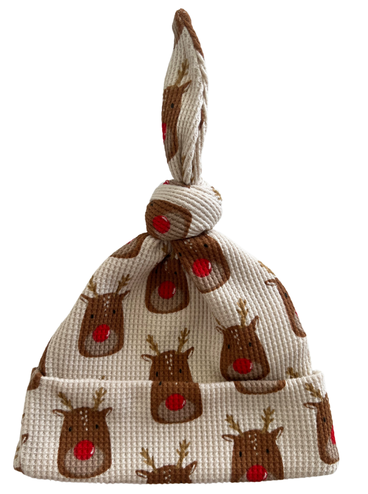 Knotted baby hat with a reindeer design, featuring a soft texture and festive colors.