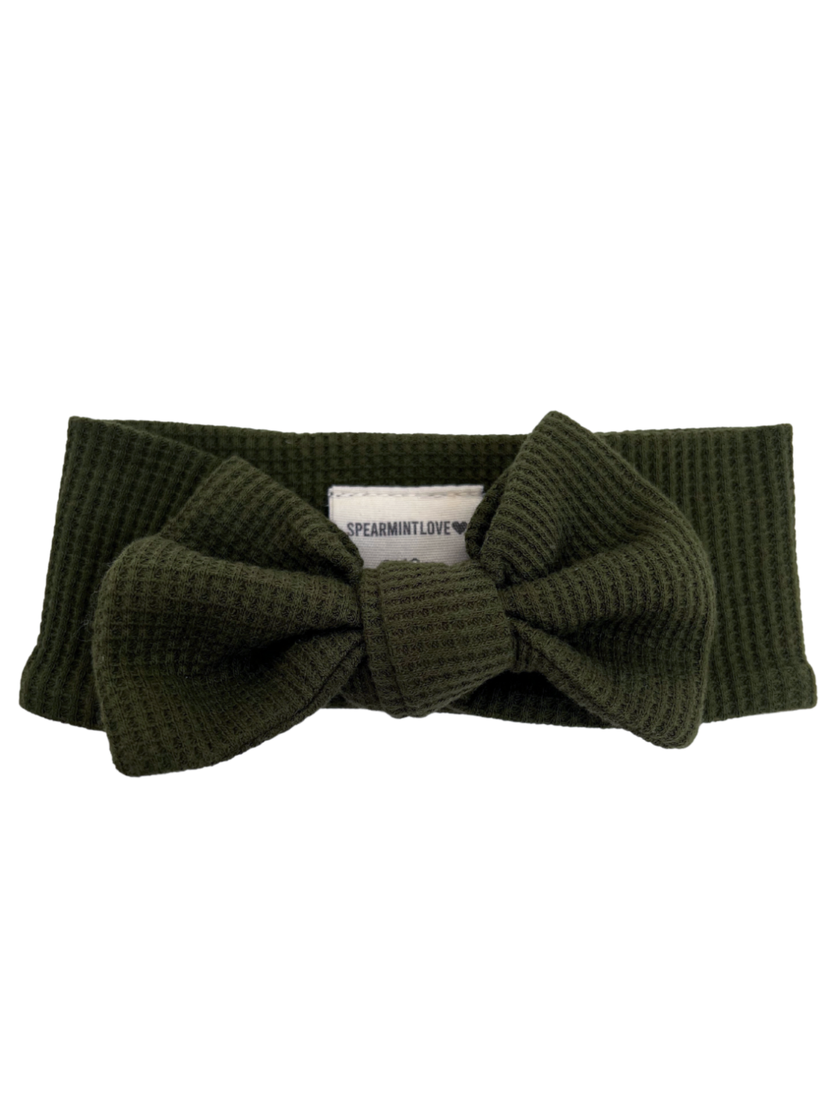 Olive green headband with a large bow, featuring a branded tag, perfect for stylish accessories.