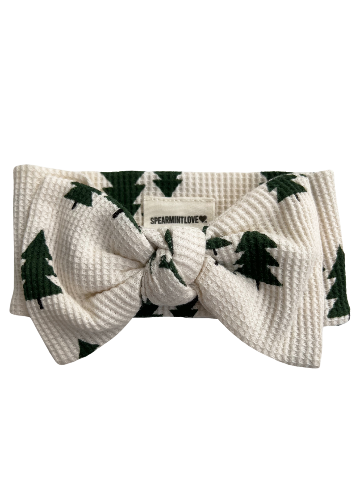 White headband with green tree pattern and a large bow, labeled "SPEARMINTLOVE."