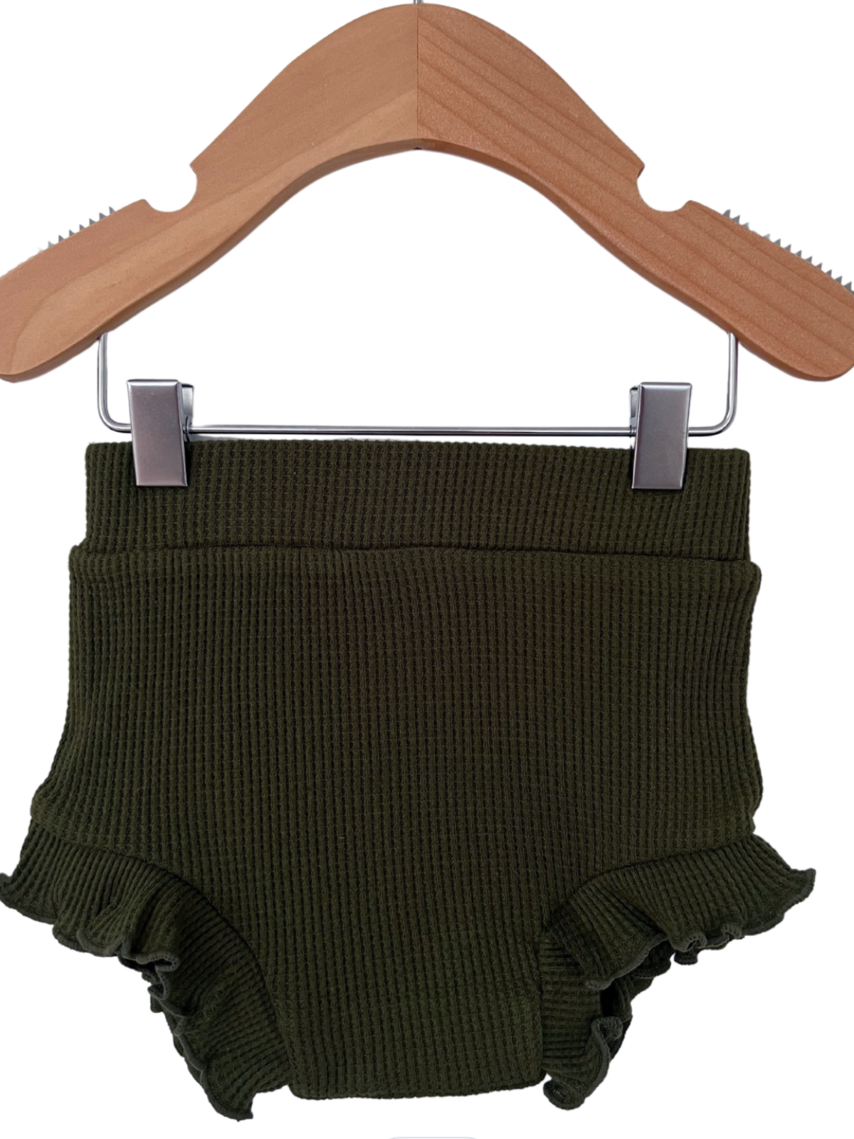 Olive green ribbed baby bloomer shorts with ruffled edges, displayed on a wooden hanger.