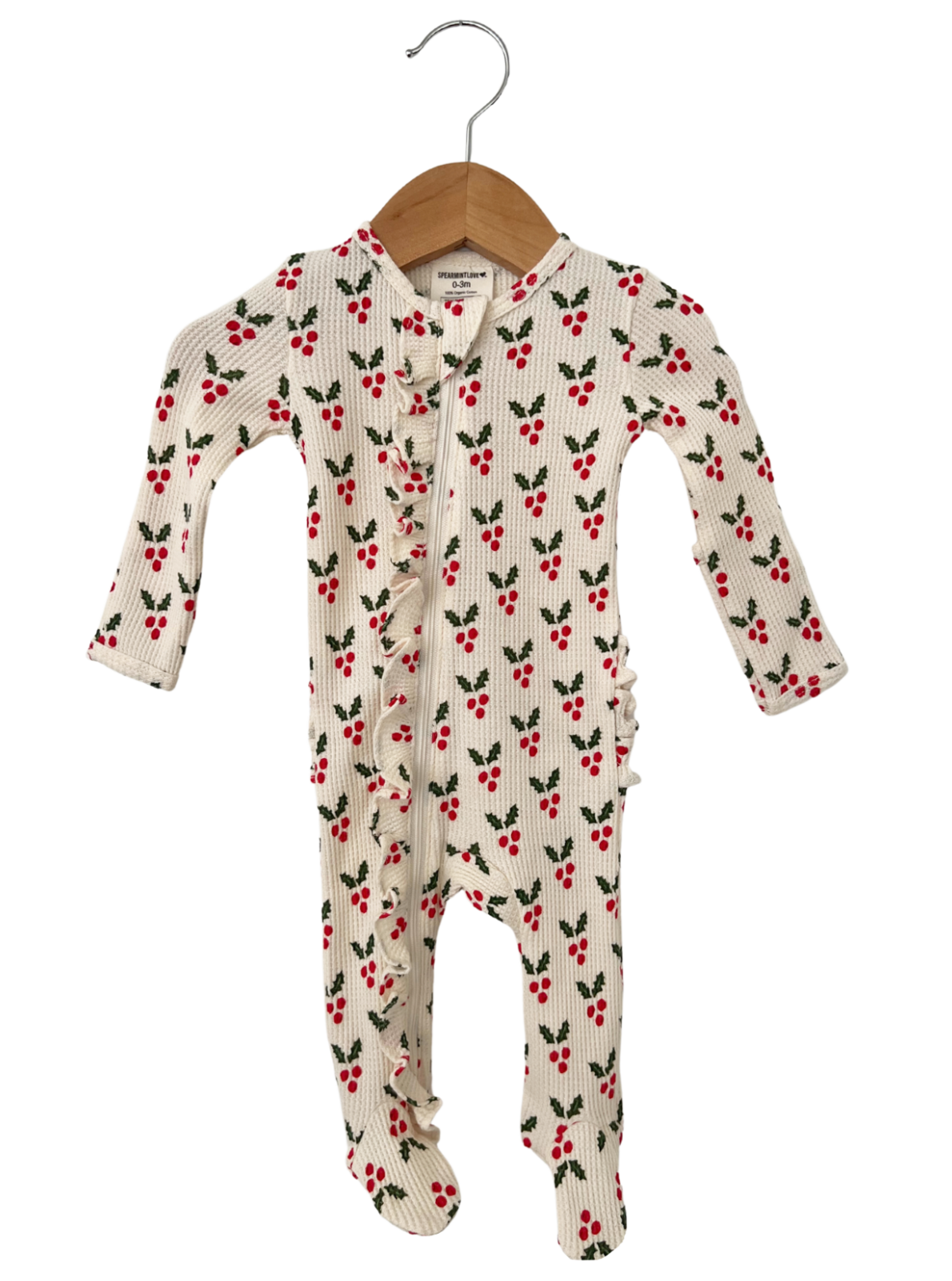 White baby onesie with red cherry and green leaf pattern, featuring ruffles and a front zipper.