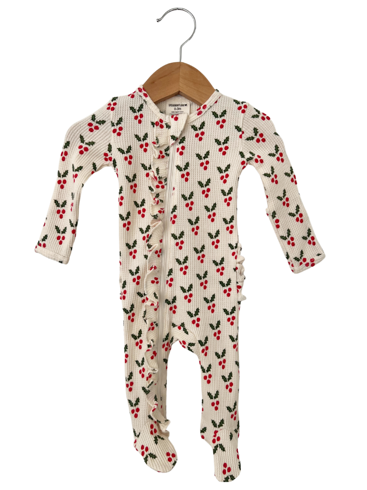 White baby onesie with red cherry and green leaf pattern, featuring ruffles and a front zipper.