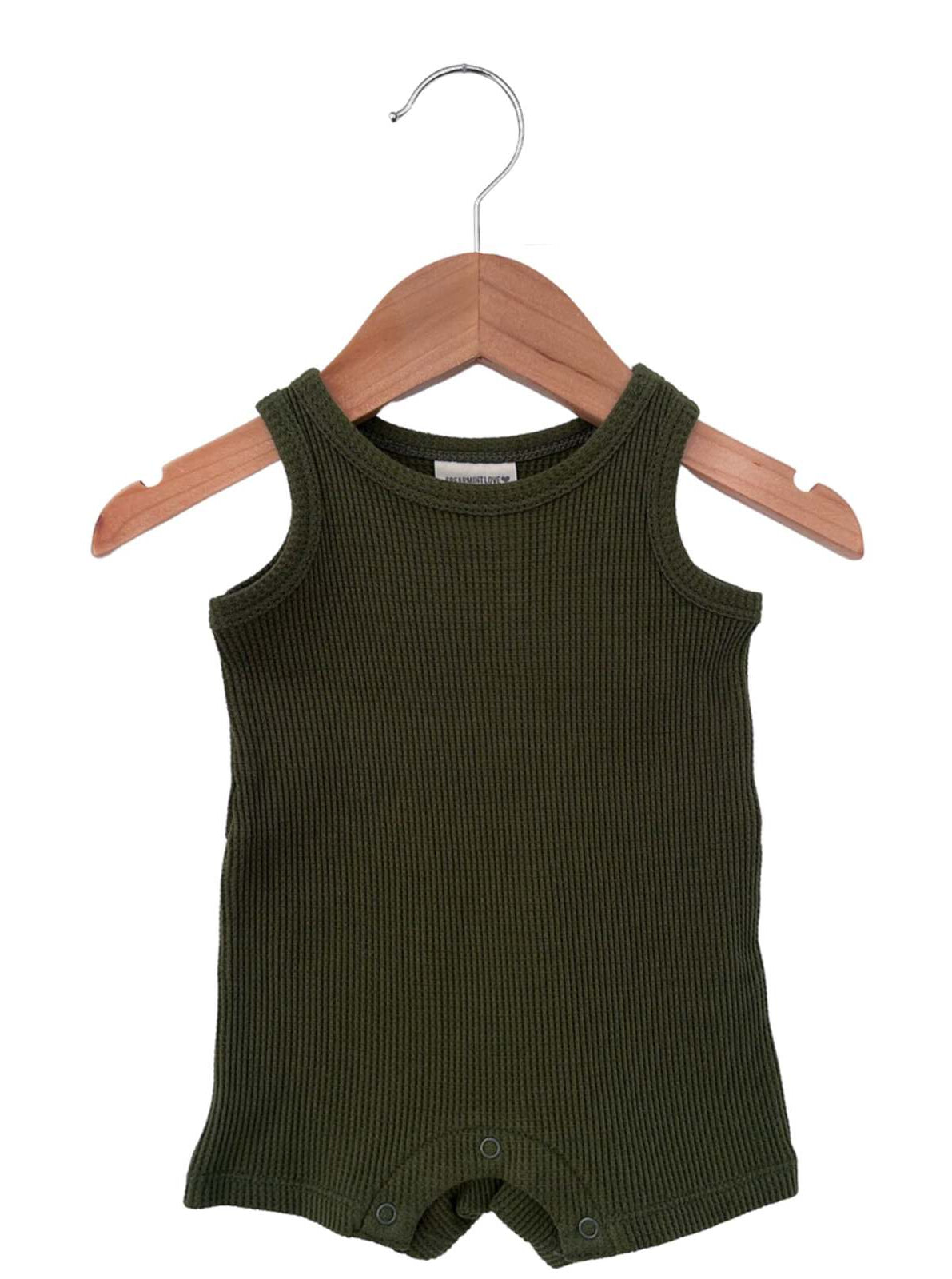 Olive green ribbed sleeveless onesie hanging on a wooden hanger.