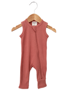 Light pink sleeveless infant romper with a front zipper, hanging on a wooden hanger.