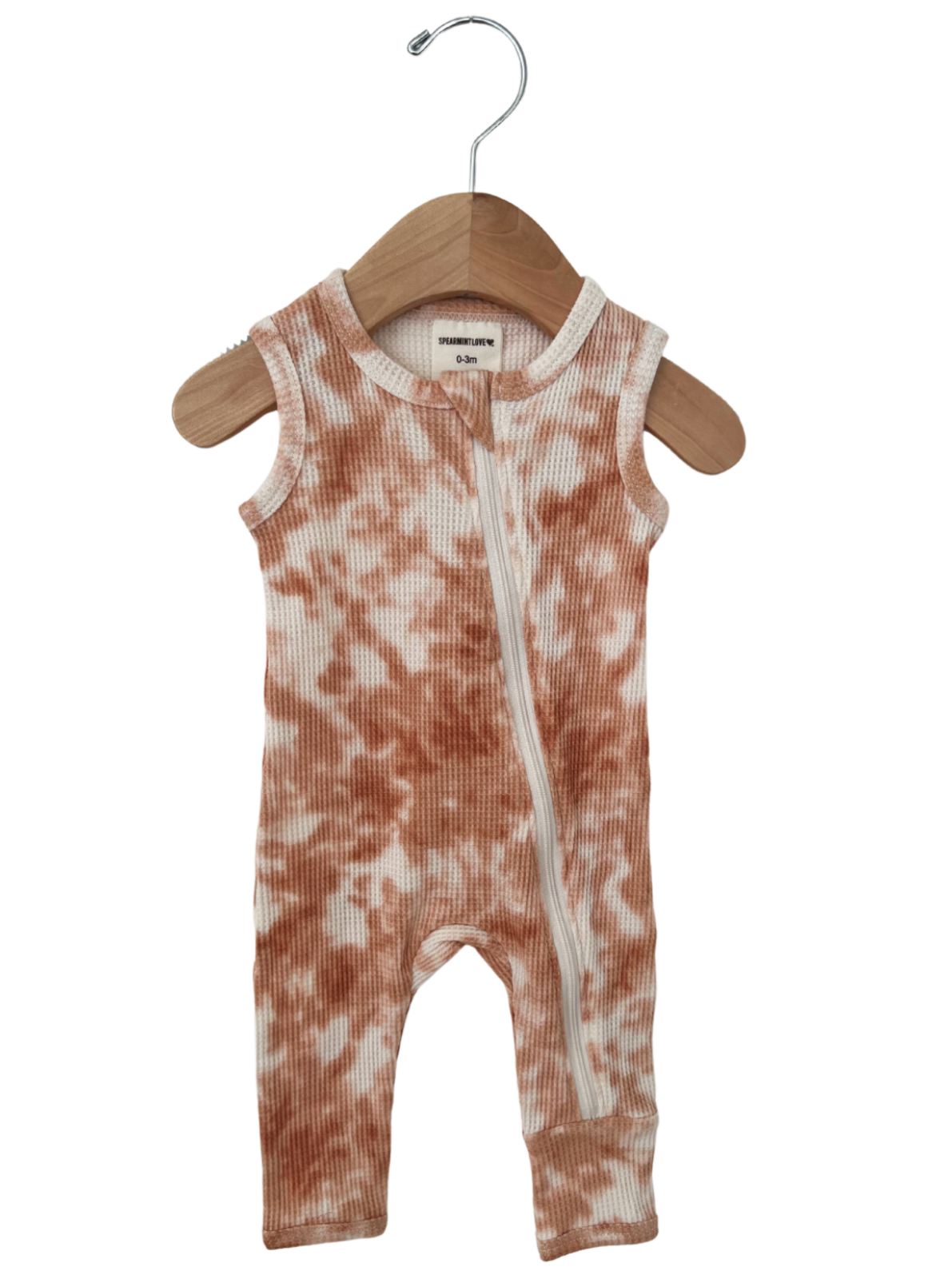 Brown tie-dye baby romper on a wooden hanger, sized for 0-3 months.