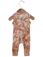 Peach tie-dye romper hanging on a wooden hanger against a white background.