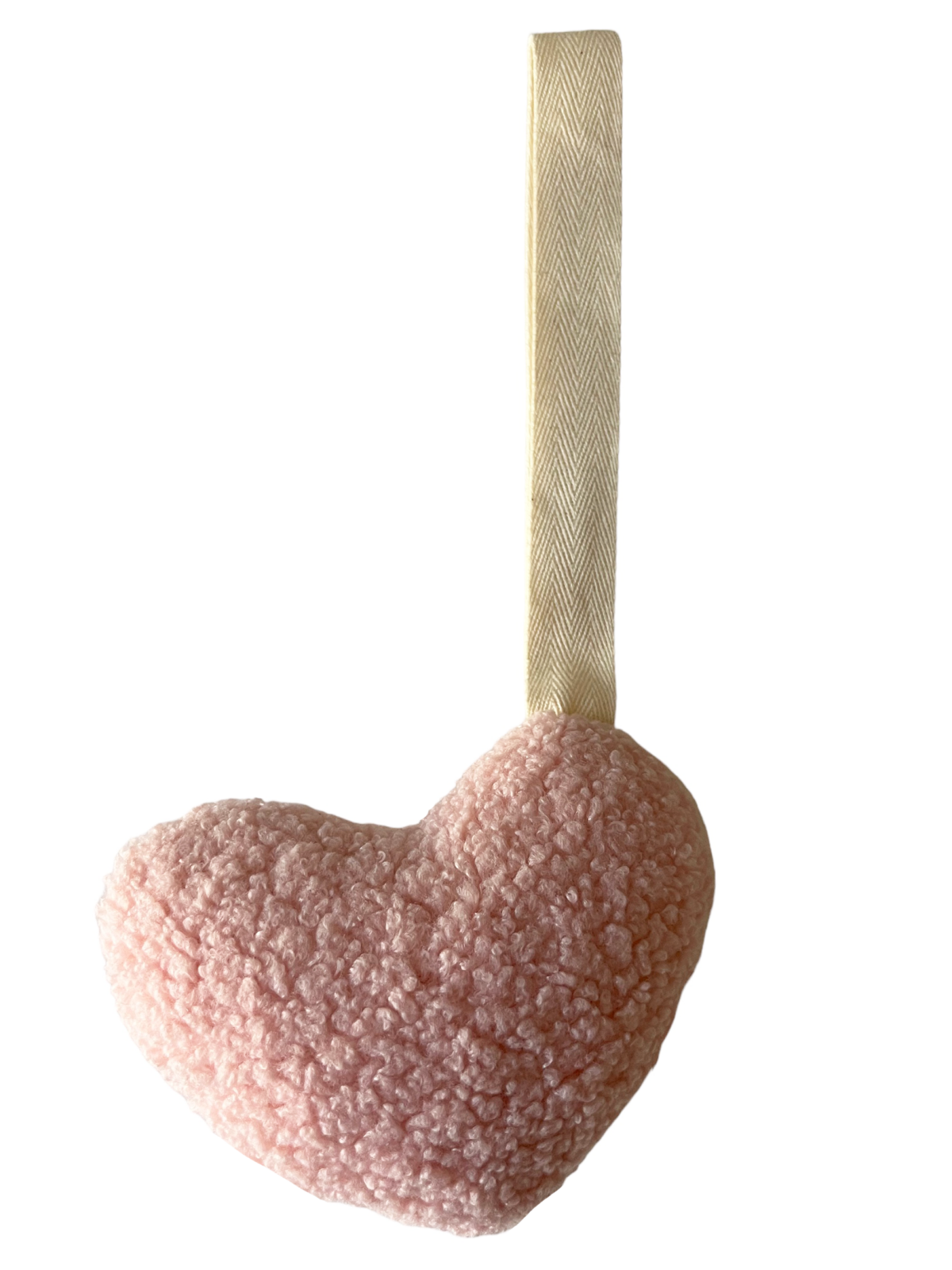 Soft pink heart shape plush toy with a beige ribbon hanger, ideal for decoration or gifting.