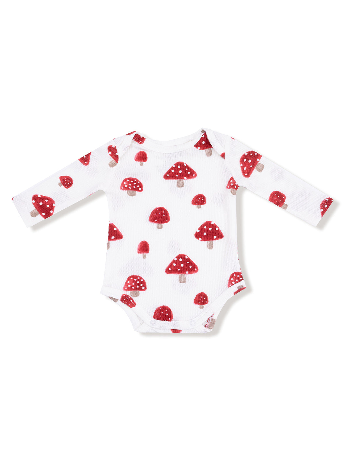 White baby onesie featuring a red mushroom print with long sleeves.