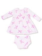Pink bow-patterned baby dress with matching bloomers, featuring long sleeves and a round neckline.