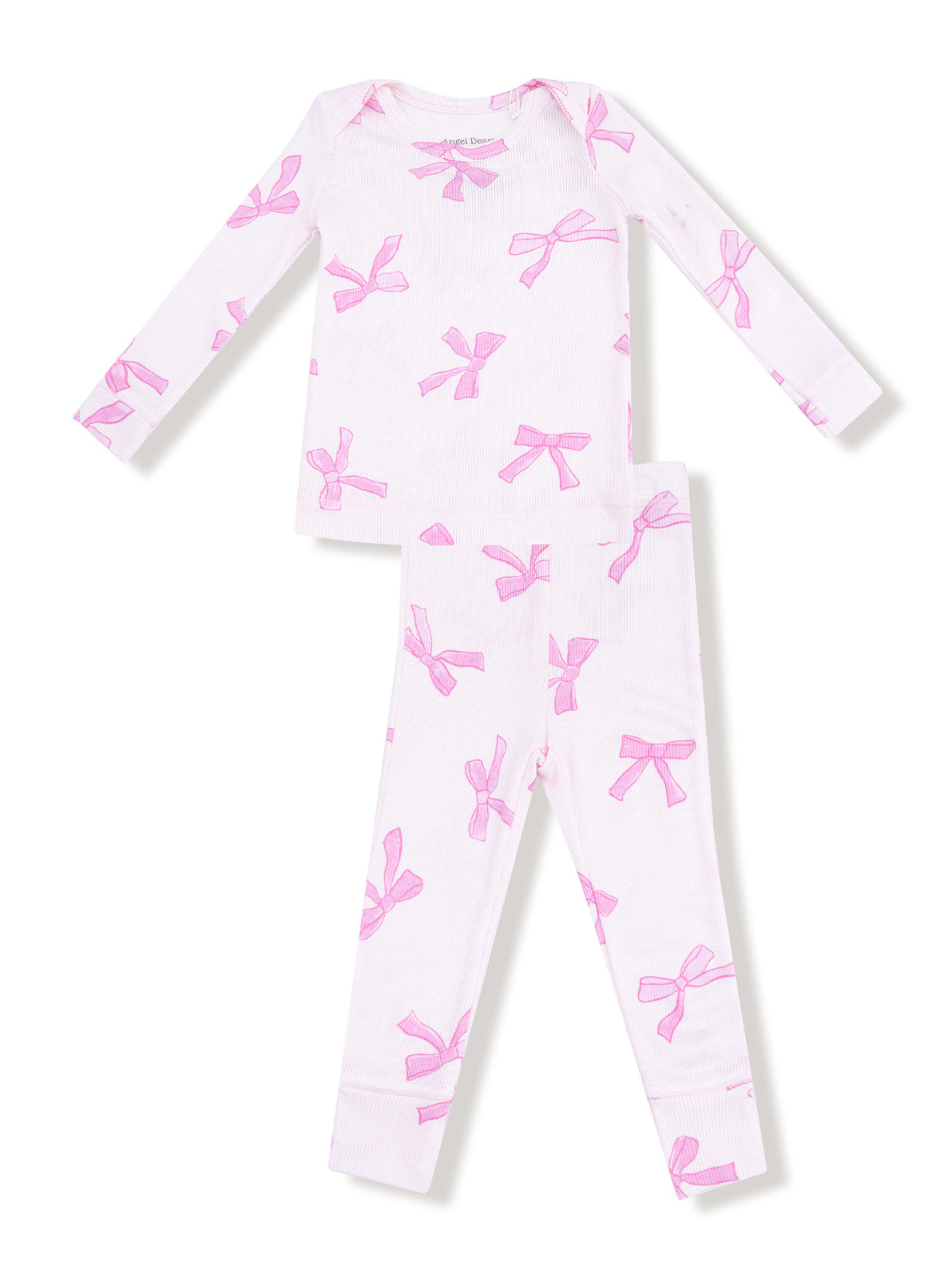 White pajama set featuring pink bows, includes long-sleeve top and matching pants.