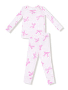 White pajama set featuring pink bows, includes long-sleeve top and matching pants.